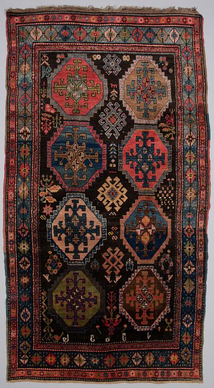 A ANTIQUE KARABAGH CARPET, 247x135 cm.