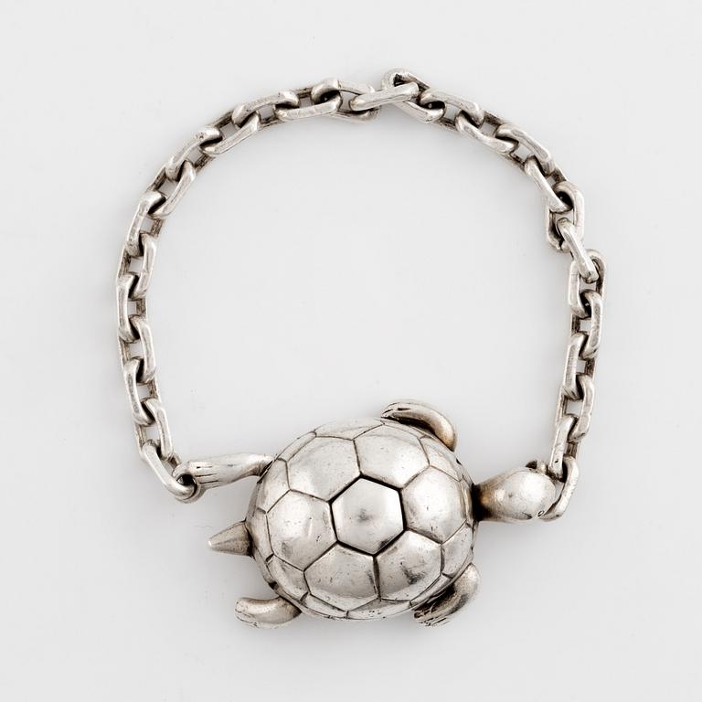 Hermès, silver turtle key charm.