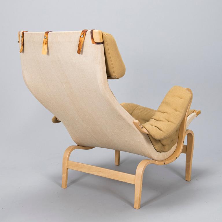 Bruno Mathsson, A "Pernilla" armchair with footstool, for DUX, designed in 1944.