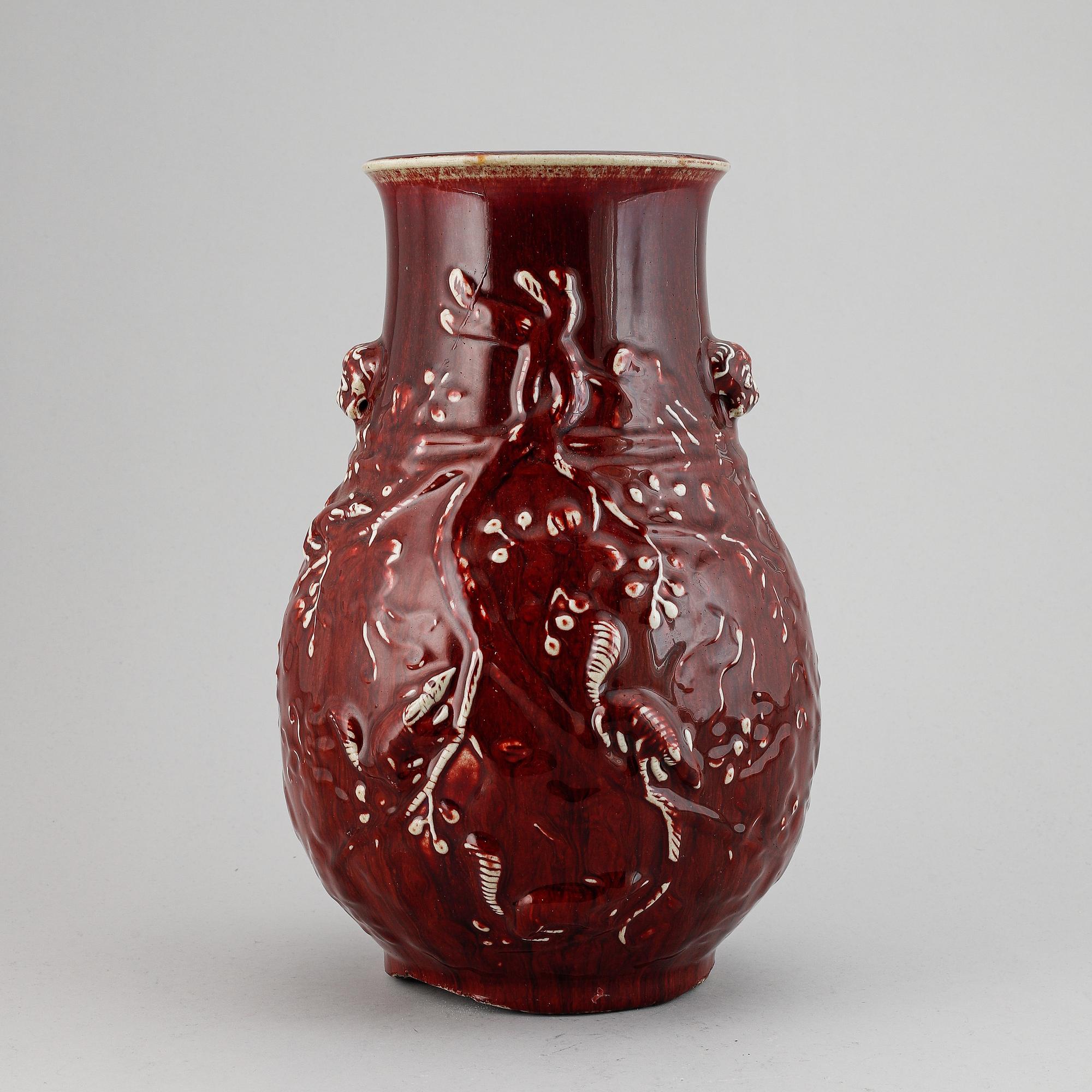 A red glazed Chinese vase, 20th century.
