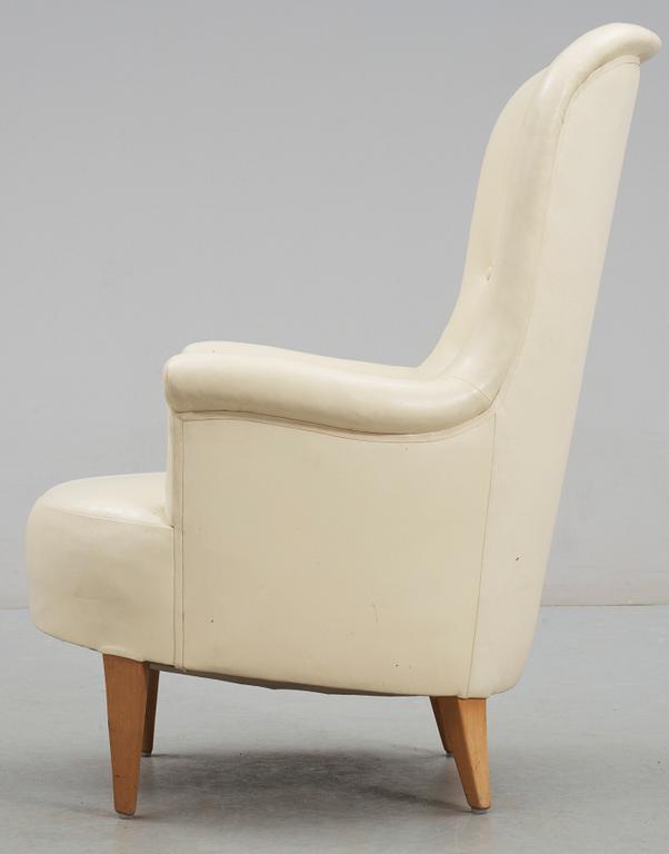 A Carl Malmsten 'Marino' white leather easy chair.