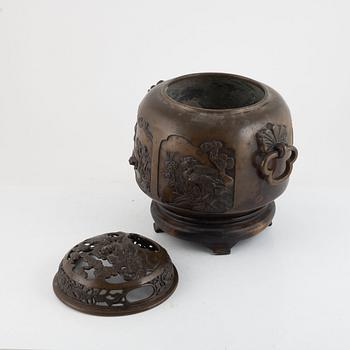 A bronze urn with stand, Japan, presumably Meiji (1868-1912).