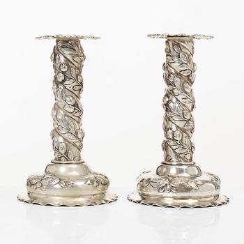 A pair of Baroque-style silver candle sticks, with Swedish import marks, first half of the 20th century.