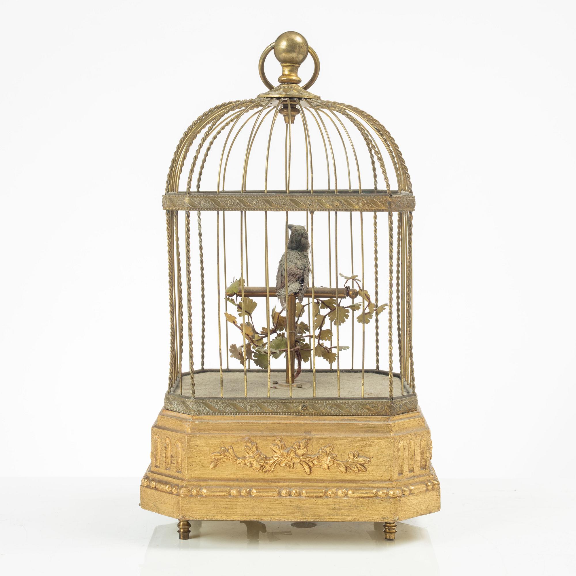 A music box in the shape of a bird's cage, France, late 19th century.