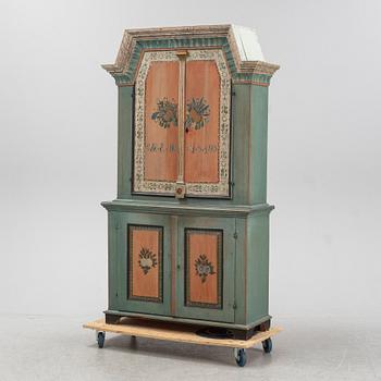 A painted Swedish provincial cabinet from Jämtland, dated 1849.