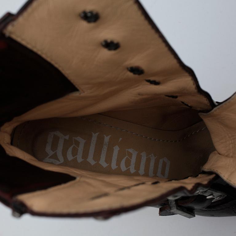 JOHN GALLIANO, a pair of brown leather boots.