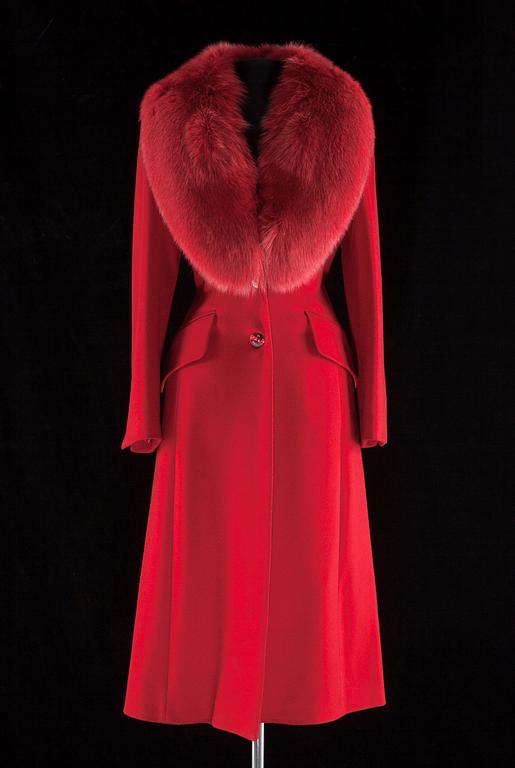 A red cashmere coat with detachable fur neck by Esacada.