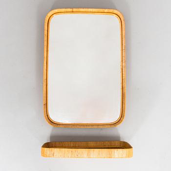 A mid -20th century mirror and consoile.