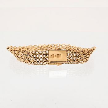 An 18K gold x-link bracelet.