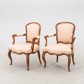 A pair of 19th century Rococo style armchairs.