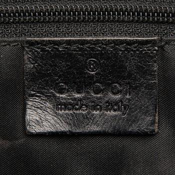 A Black Leather Jackie Bag.