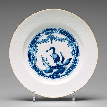 916. A set of four blue and white armorial dinner plates, Qing dynasty, 18th Century.