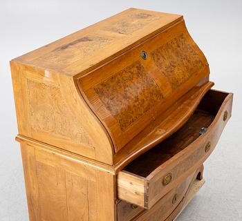 A slant-front chest of drawers, late Baroque style, 19th century.