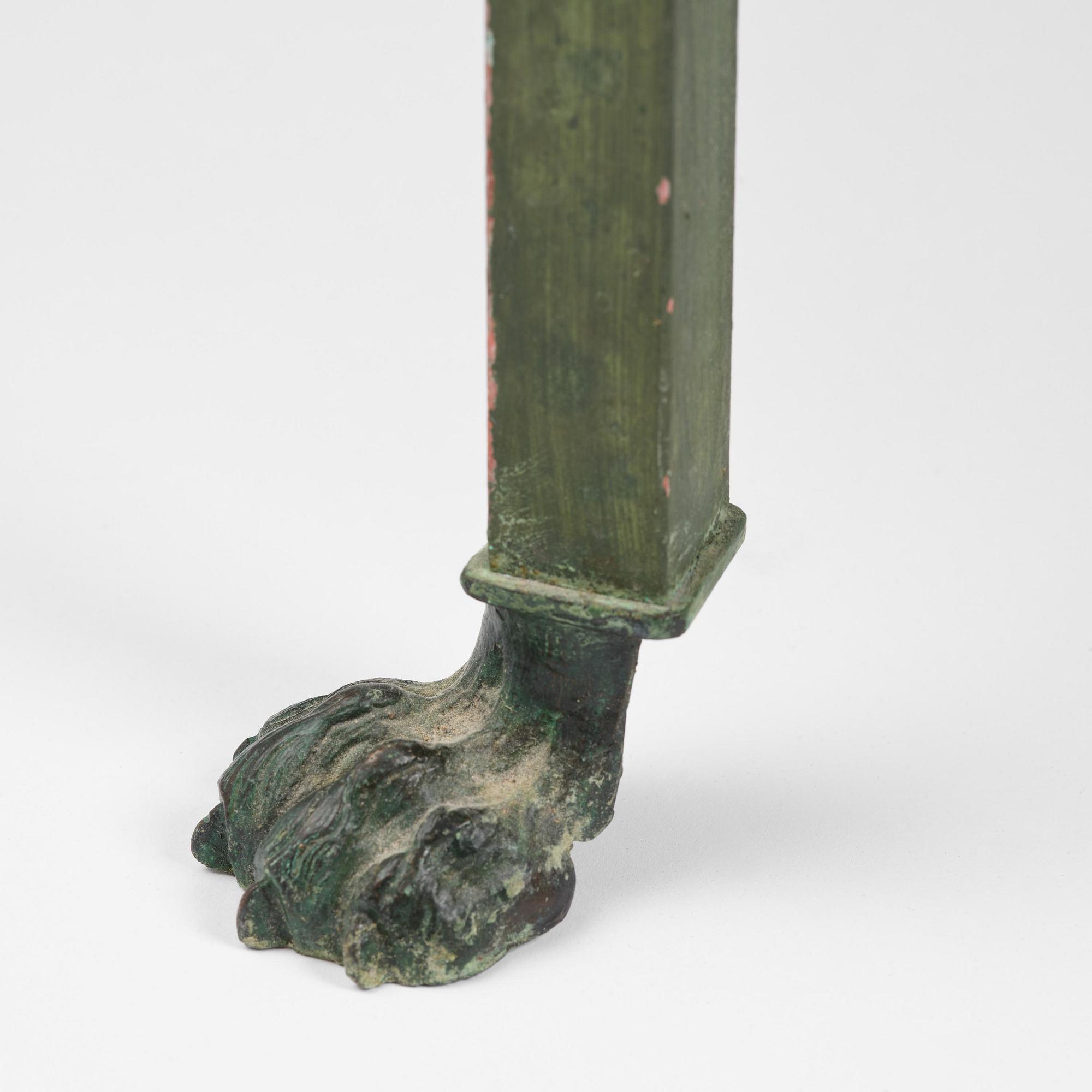 A table with Swedish 'Orrlok' porhyry top, early 19th century on a later bronze stand.