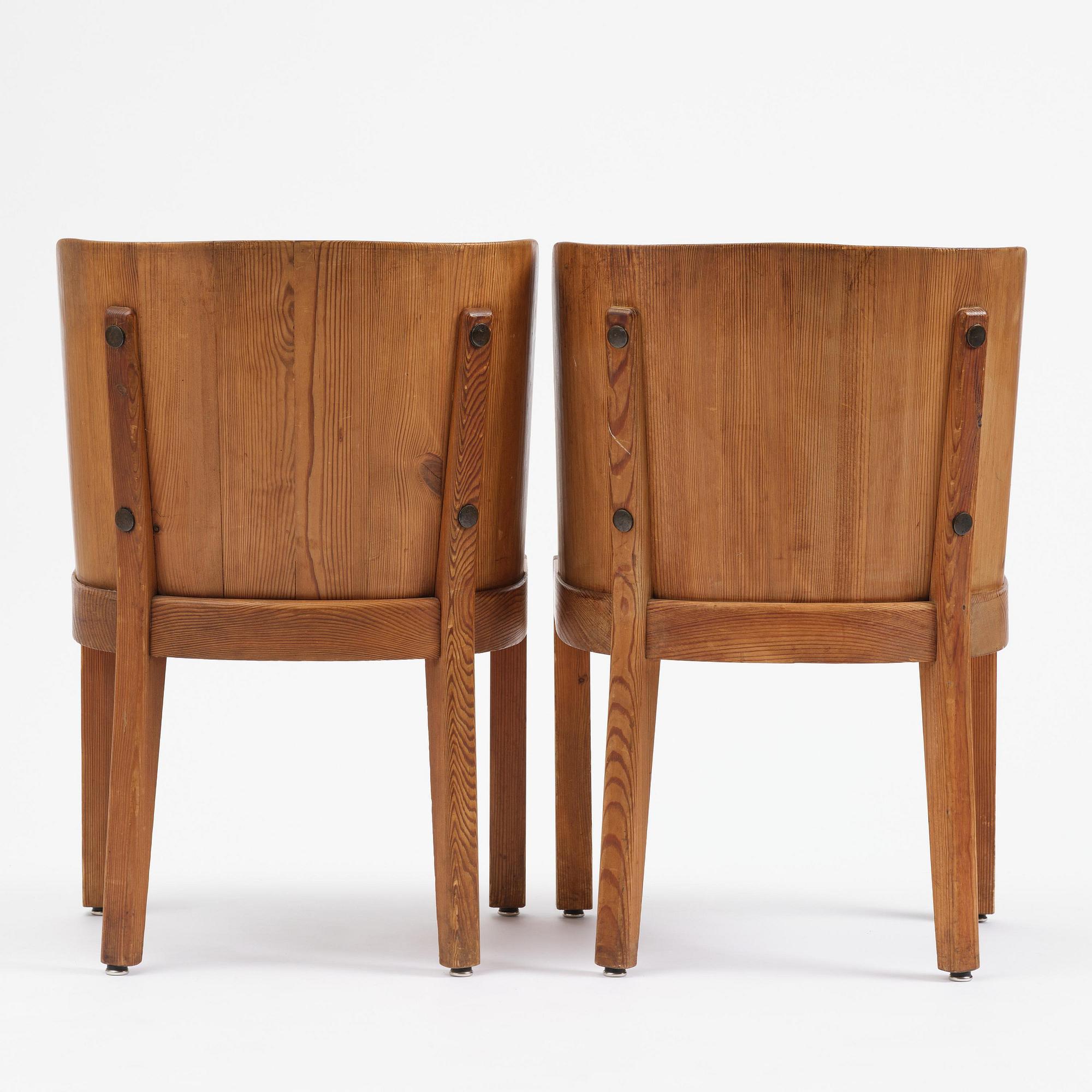 Axel Einar Hjorth, a pair of stained pine "Lovö" armchairs, Nordiska Kompaniet, Sweden, 1930s.