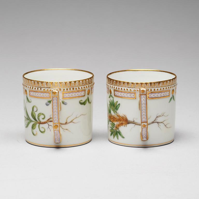 A pair of Royal Copenhagen "Flora Danica" coffee cups with stands, Denmark, 20th Century.