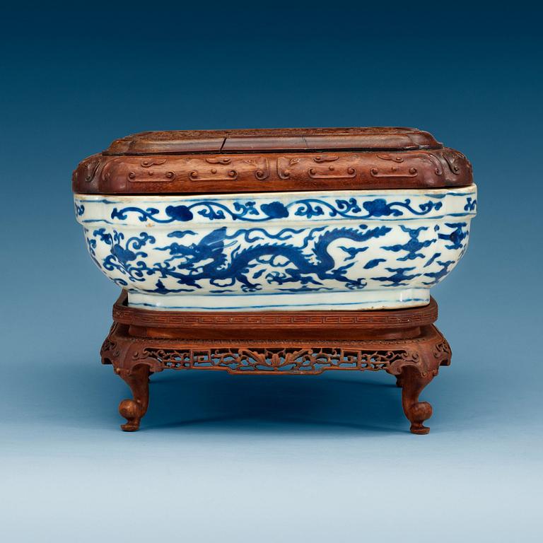 A blue and white five clawed dragon box with a wooden cover and stand, Ming dynasty with Wanli six character mark.