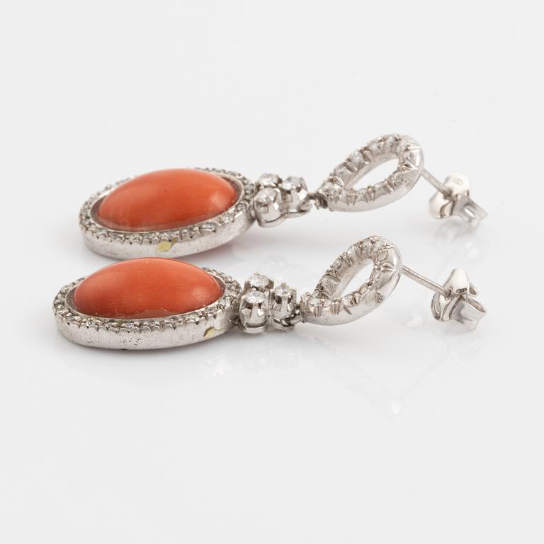 Coral and brilliant cut diamond earrings.