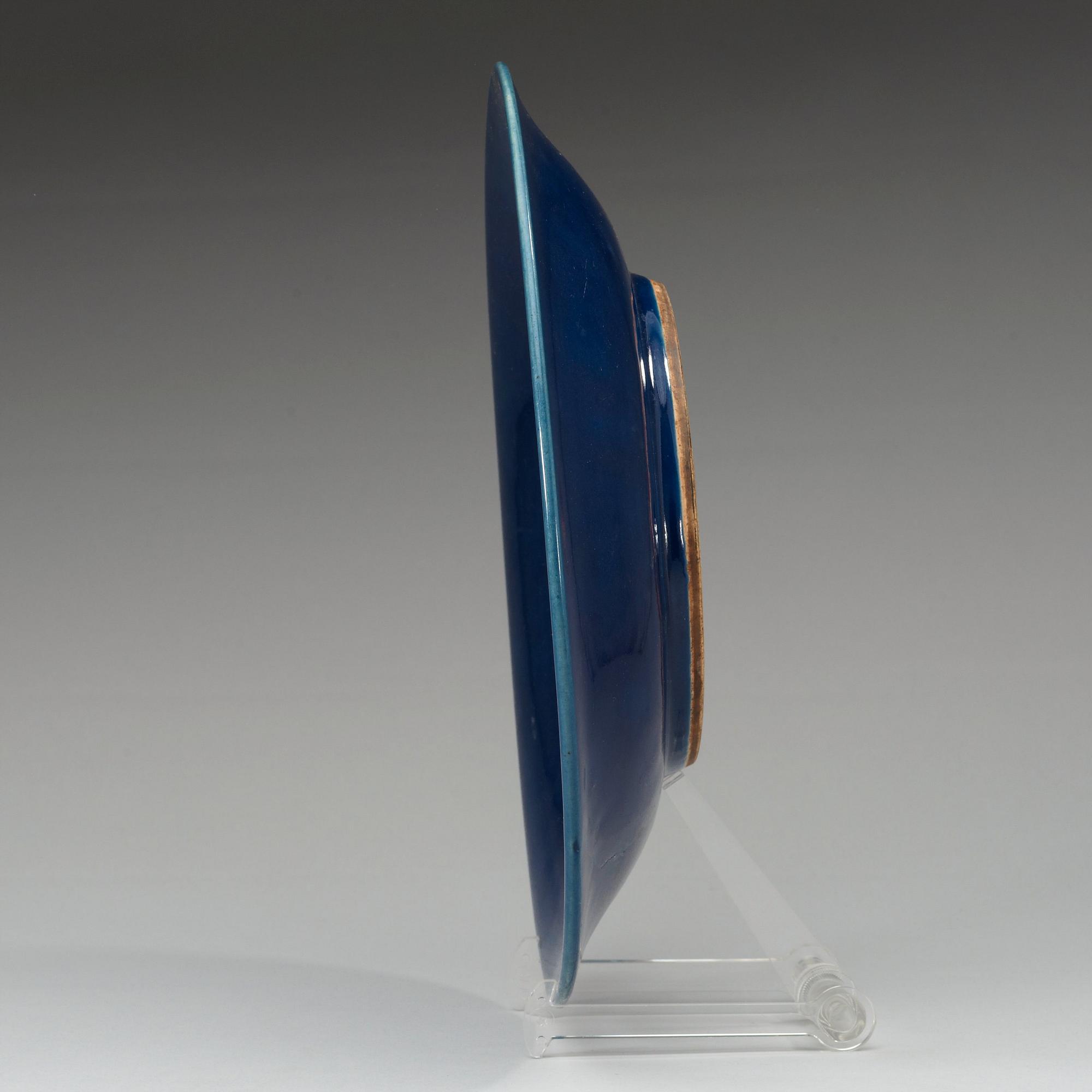 A blue glazed dish, Qing dynasty (1644-1912), with Qianlong seal mark.