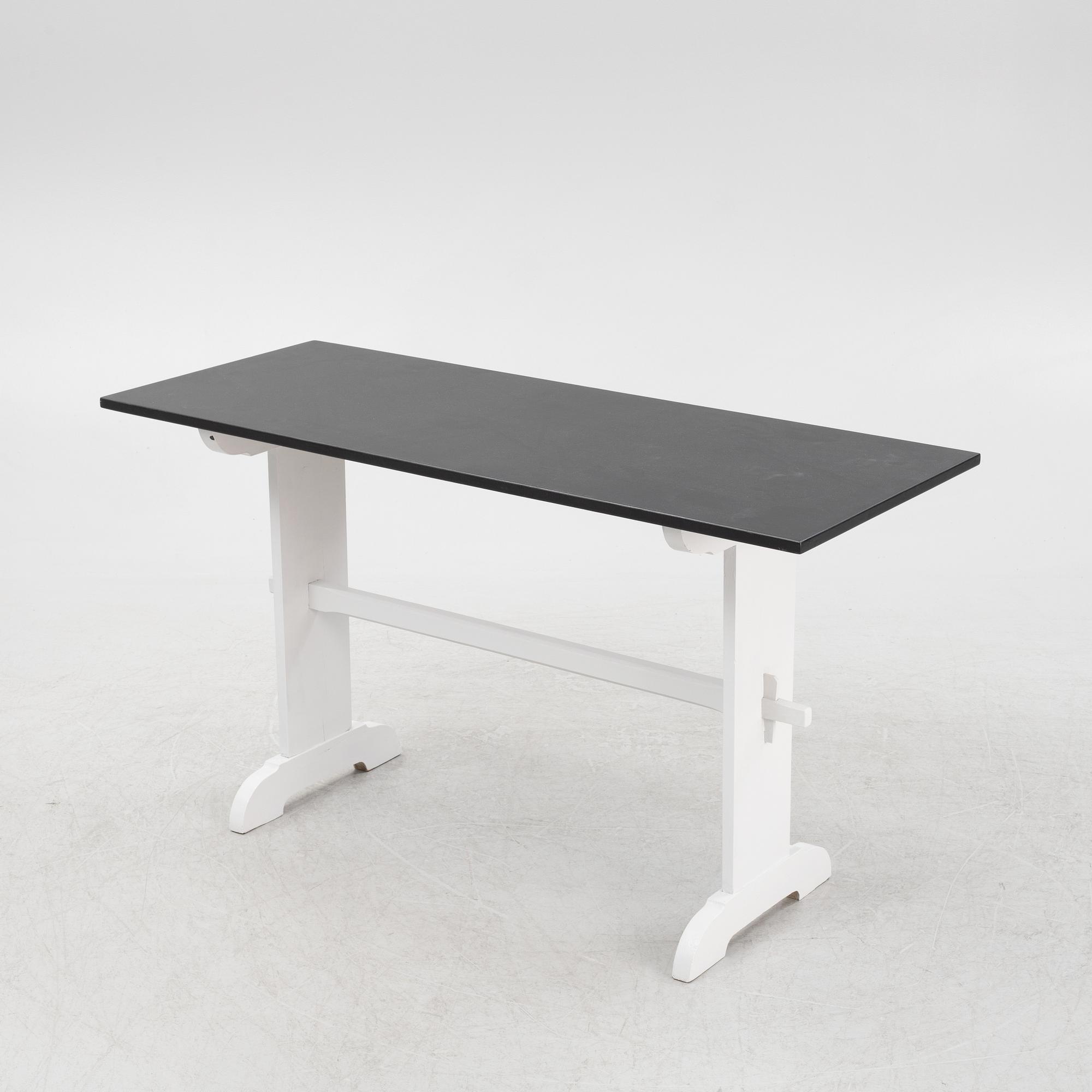A painted table, 20th Century.