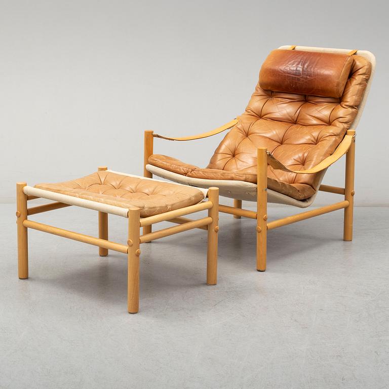 BROR BOIJE, a 'Junker' leather covered easy chair and ottoman from Dux.