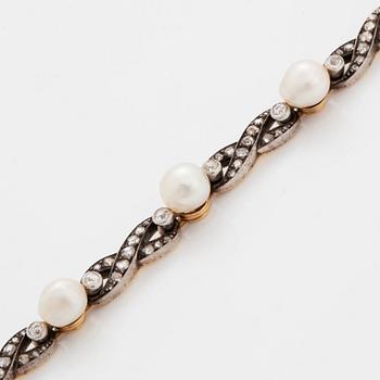 A bracelet in 18K gold and silver set with pearls and old- and rose-cut diamonds.