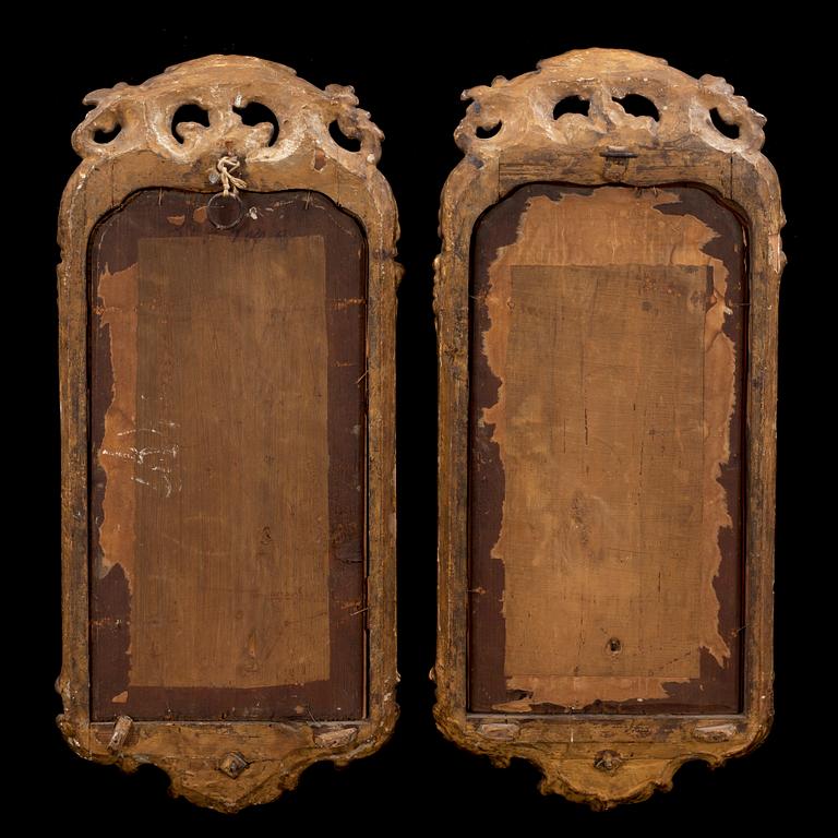 A pair of Swedish Rococo one-light girandole mirrors.