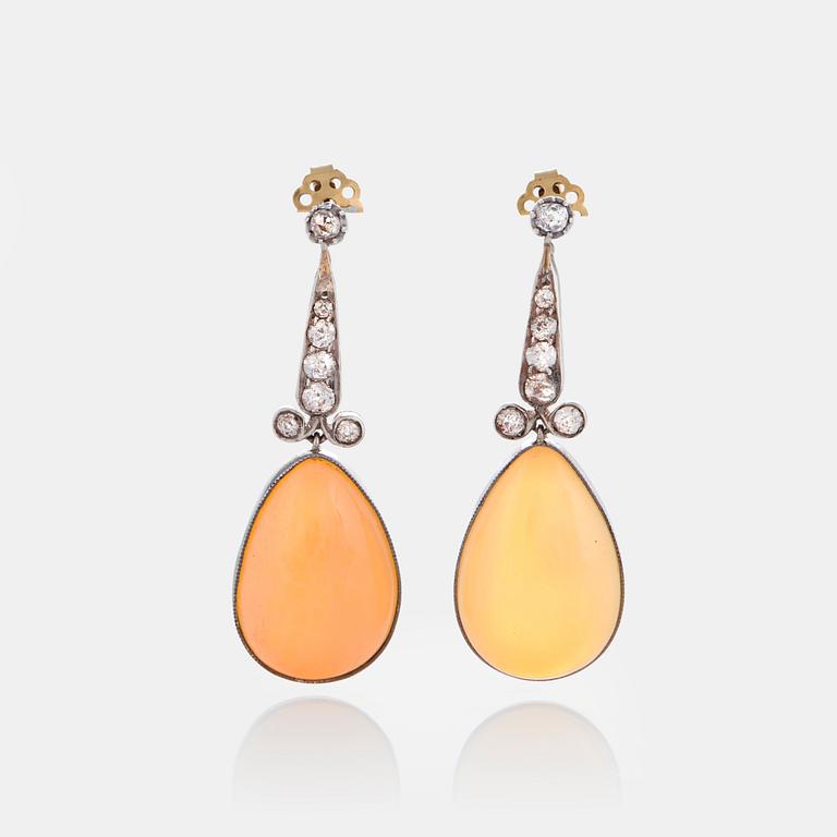 A pair of opal earrings set with old-cut diamonds.