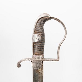 A German sabre with scabbard and a cutlass.