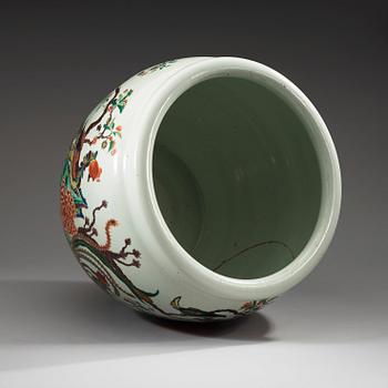 A famille rose jardiniere, decorated with a terrace scene with blossom and birds, late Qing dynasty, about 1900.