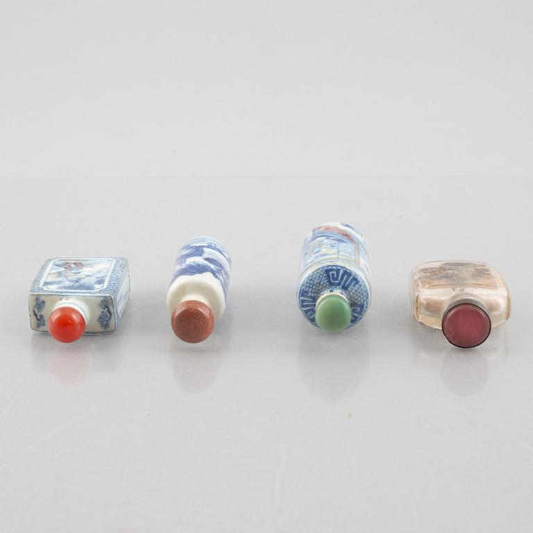 A group of nine Chinese glass and porcelain snuffbottles, 20th century.