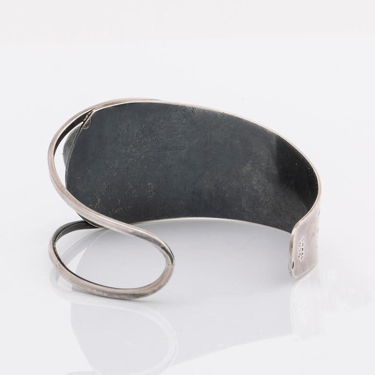 2 silver bracelets, 1 with a green stone, wider bracelet swedish import mark, original invoice dated 1977.