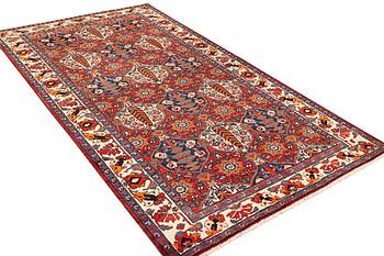 A Hamadan carpet, a. 335 x 184 cm.