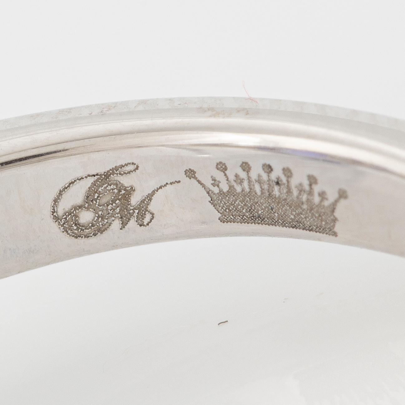 Ring in 18K white gold with tanzanite and baguette-cut diamonds.