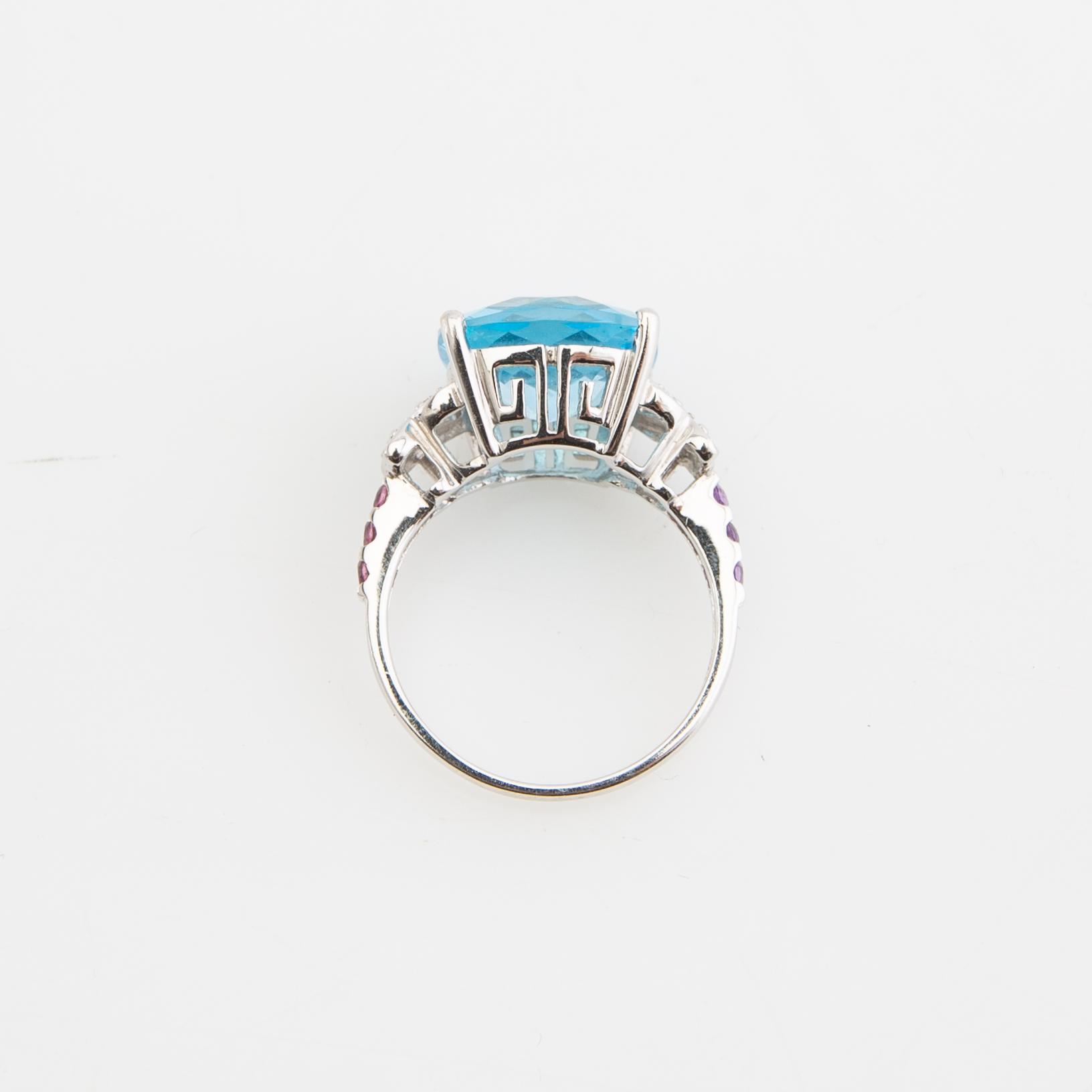 Ring, 14K gold with topaz, diamonds, and purple garnets.