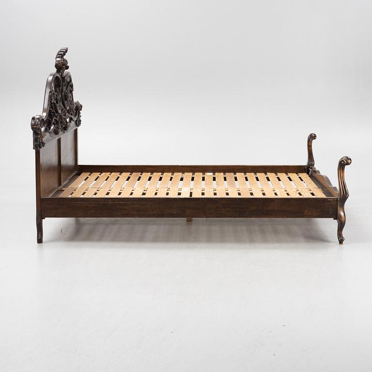 A rococo style bed frame, around 1900.