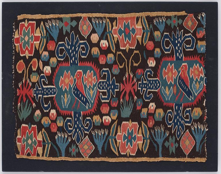 An 18th century carriage cushion, "Den innelykta fågeln", tapestry weave,  ca 52 x 67 cm, Scania (Sweden).