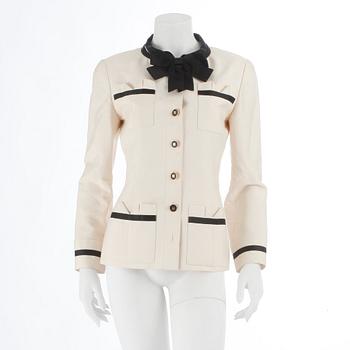 CHANEL, a black and white silk jacket.
