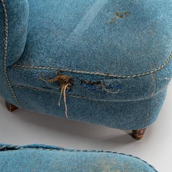 A pair of mid-20th-century armchairs.