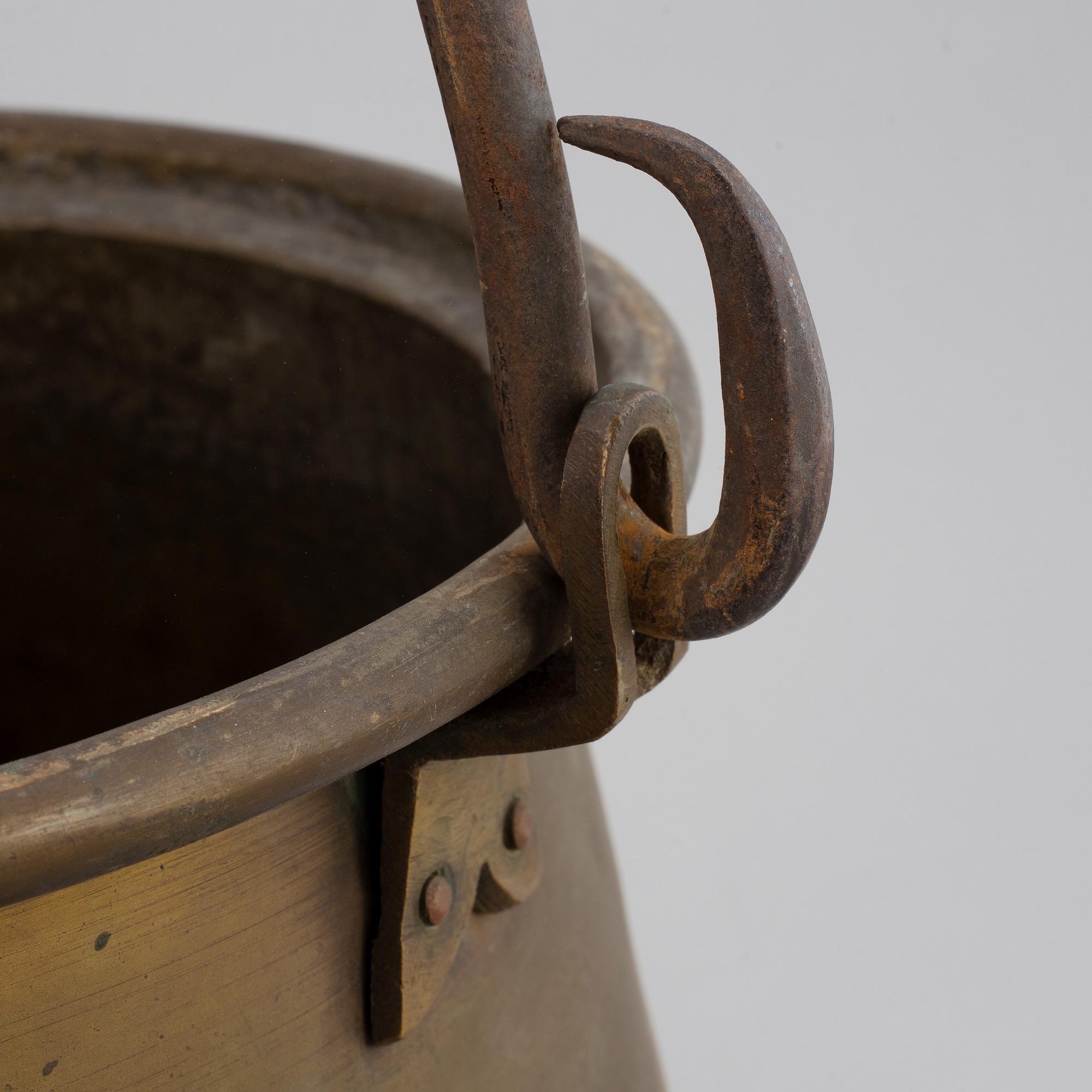 A large 18th century brass cauldron.