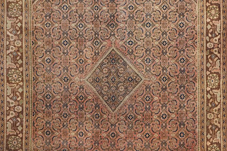 An oriental, vintage design carpet, c. 317 x 216 cm.