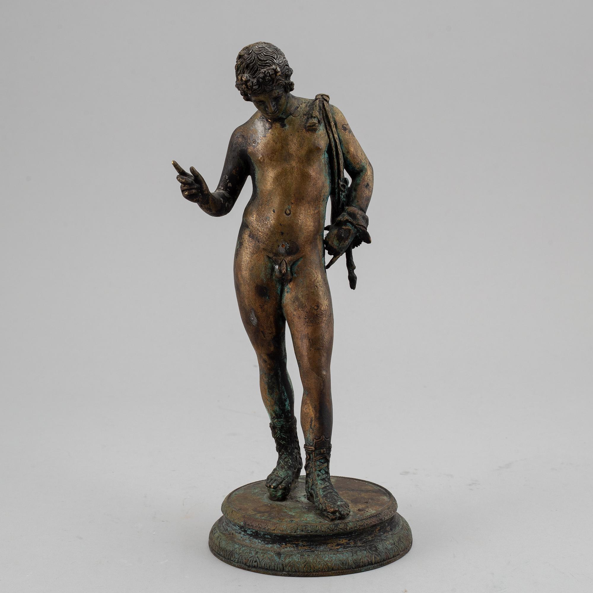 A 20th century bronze sculpture of Narcissus.