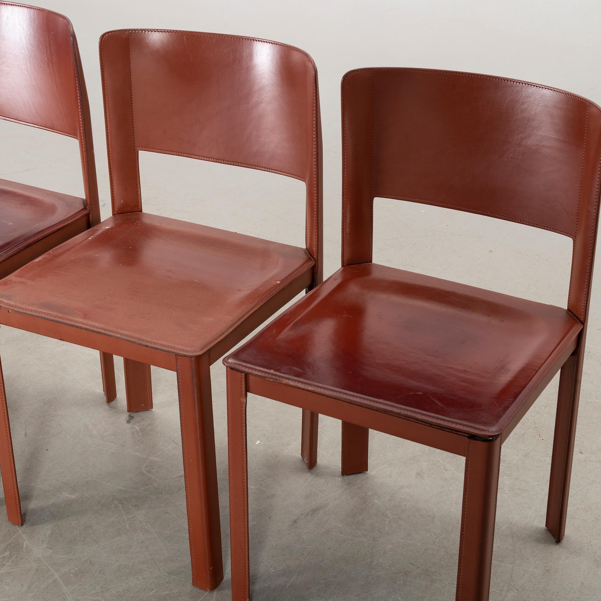 MATTEO GRASSI, a set of four leather chairs.