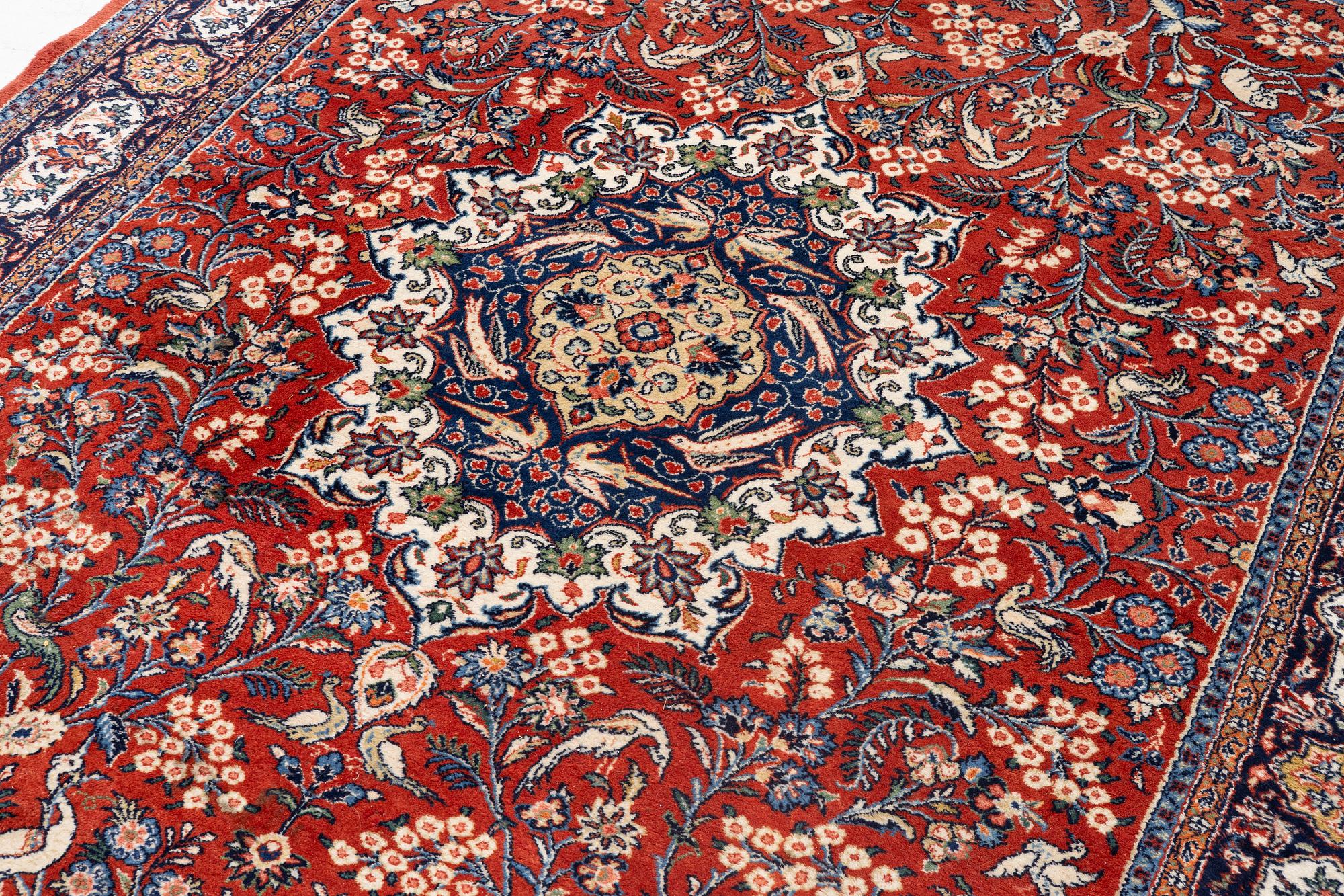 A Sarouk carpet, c. 330 x 215 cm.