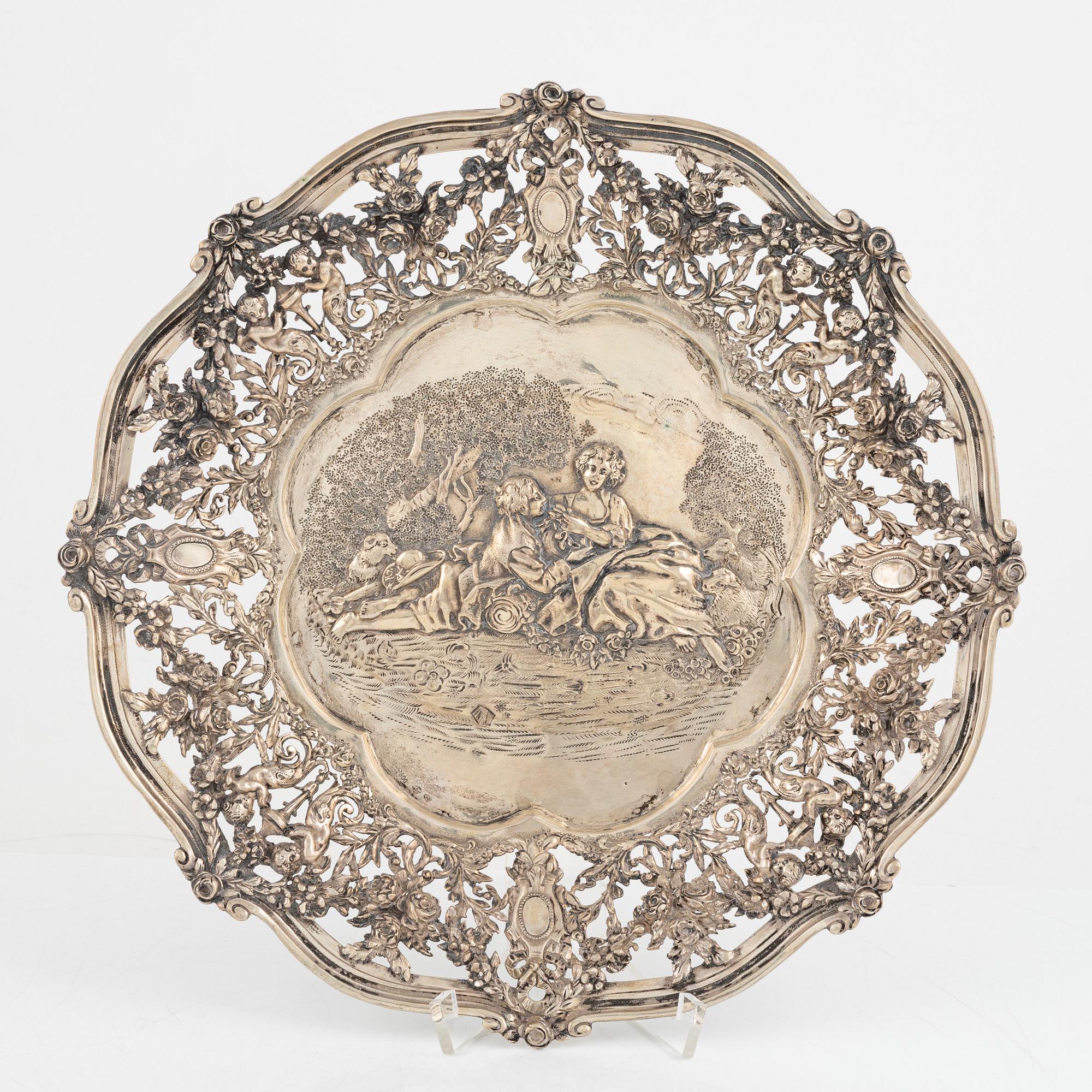 Two silver platters, presumably Wilhelm Weinranck, Hanau, and mock marks, Hanau, Germany, late 19th century.
