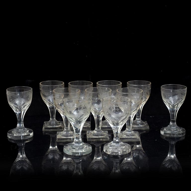 A set of 11 wine glasses and three decanters with stoppers, 19th century.