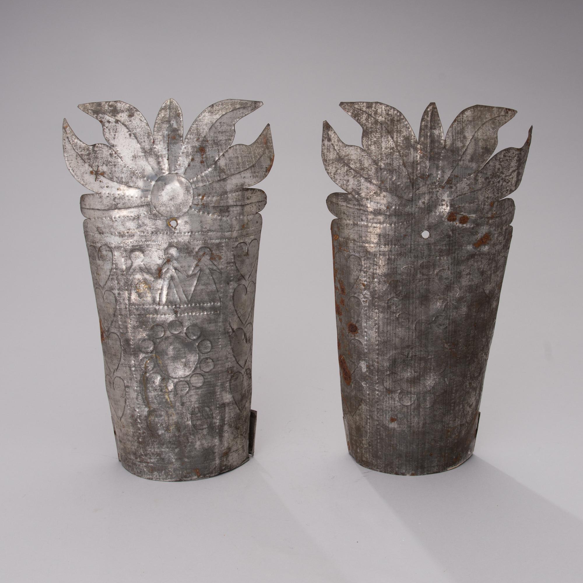 A pair of late 19th century tin wall sconces.