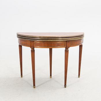 An erarly 1800s mahogany game table.