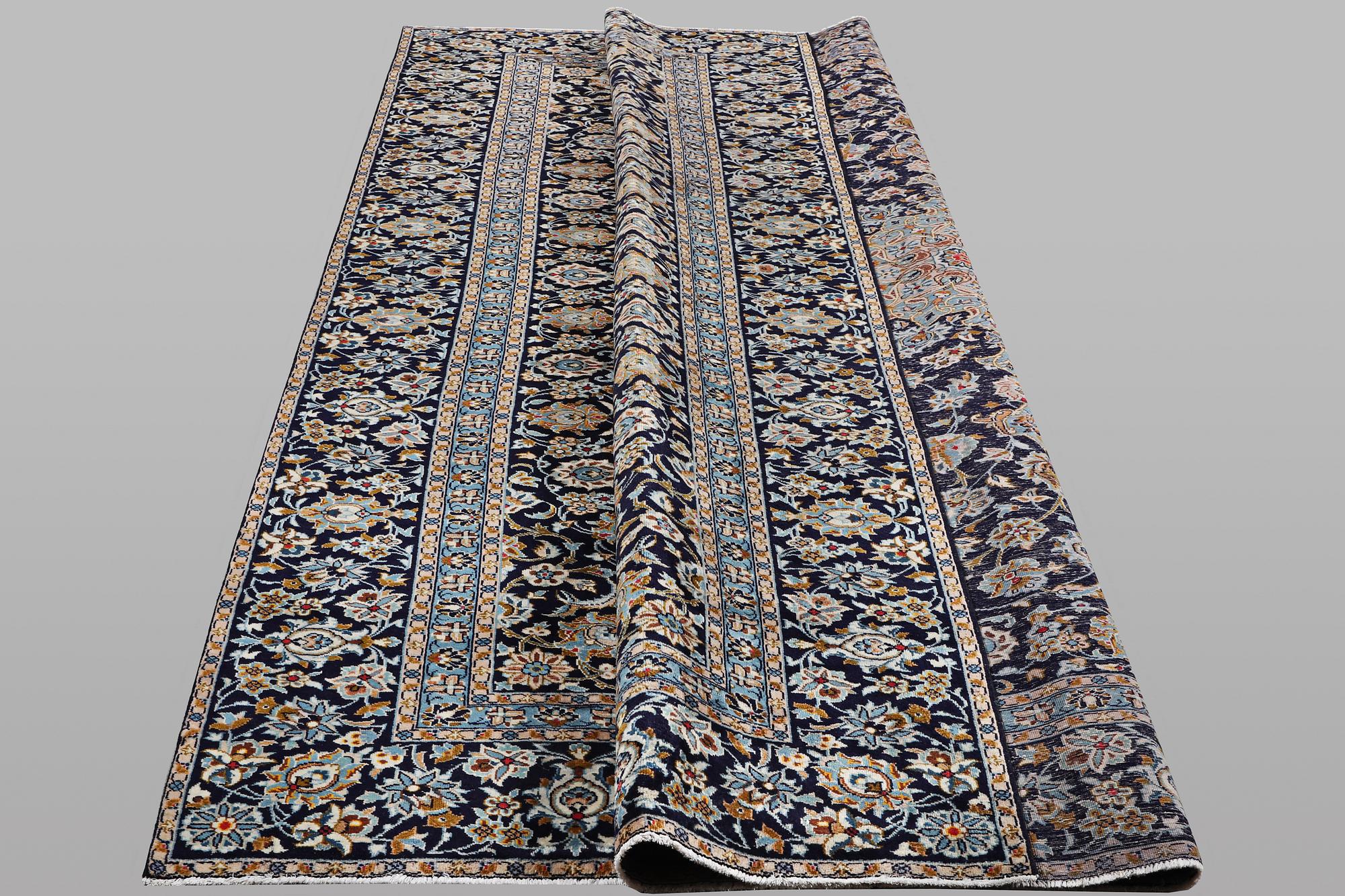 A carpet, Kashan, ca 391 x 286 cm.