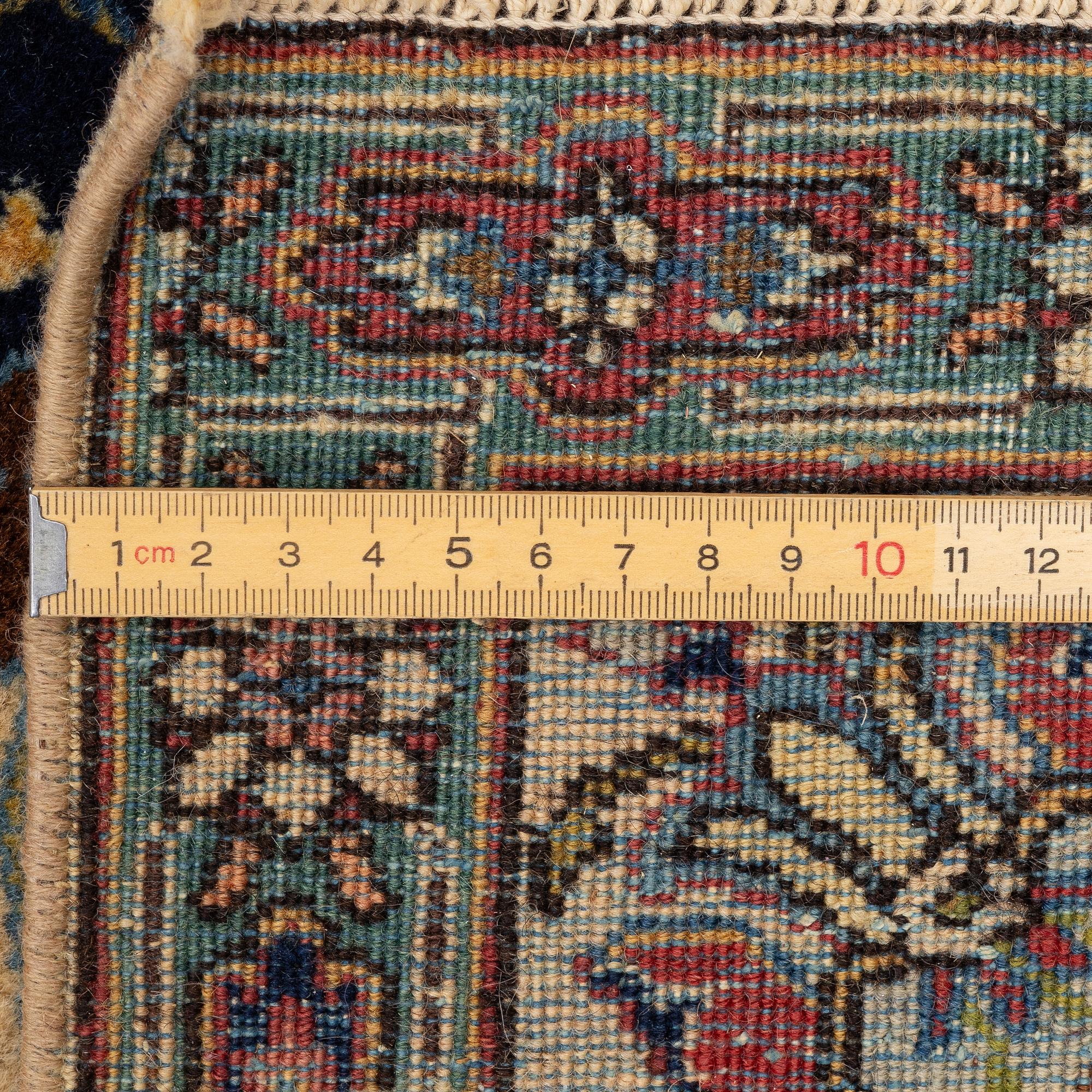 A pair of semi antique Tabriz rugs, Northwest Persia, c. 210 x 136 cm.